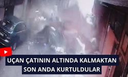 Uçan çatının altında kalmaktan son anda kurtuldular