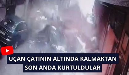 Uçan çatının altında kalmaktan son anda kurtuldular